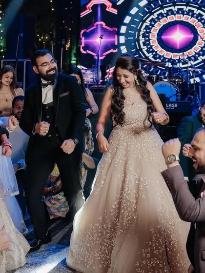 The whole group dancing together, creating a circle of fun and celebration.