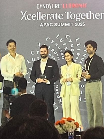 Receiving a speaker appreciation award on stage at the Cynosure Lutronic APAC Summit. I am grateful for the recognition of my contribution to the scientific program.