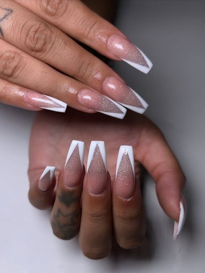 This isn't your average French manicure. I used a reflective cat-eye polish for the base and created a sharp, white V-tip for a look that's pure party energy.