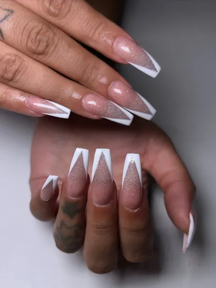 This isn't your average French manicure. I used a reflective cat-eye polish for the base and created a sharp, white V-tip for a look that's pure party energy.