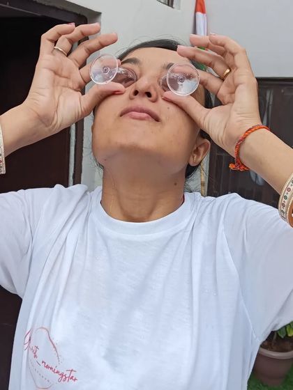 Performing eye cleansing exercises with special eye cups. This practice, called Netra Shuddhi, helps to soothe tired eyes and improve vision.