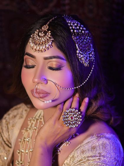 A close-up of the Heeramandi-inspired makeup. The focus is on the soft, smokey eyes, the perfectly defined lips, and the intricate details of the passajewelry.