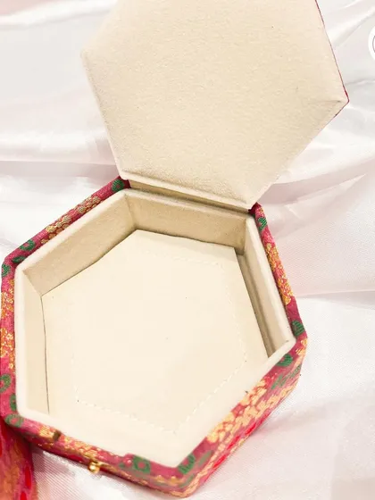The interior of our hexagonal jewelry box, showing the padded, soft-lined compartment.