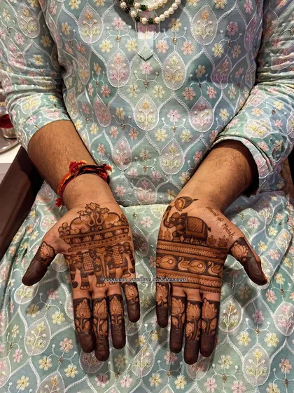A full view of the groom's traditional mehandi. The combination of animal motifs and intricate patterns creates a balanced and regal design.