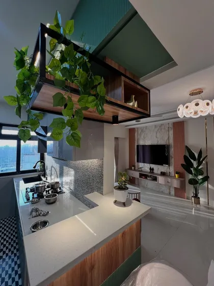 The kitchen is the heart of the home, and I design it to be both beautiful and highly functional. This open-concept kitchen features a stylish breakfast bar, ample counter space, and a touch of nature, making it a perfect spot for both cooking and connecting with family.