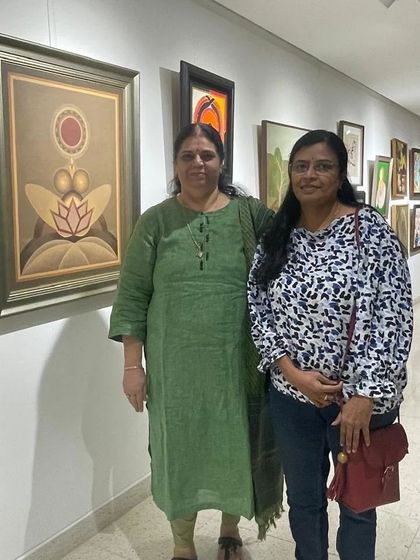 Posing with a friend in the gallery corridor, surrounded by beautiful art.