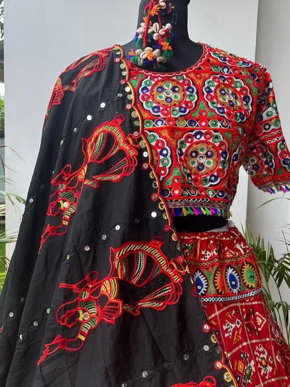A close-up of the blouse and dupatta from the previous set. You can see the detailed threadwork and mirror embellishments that make this piece so special.