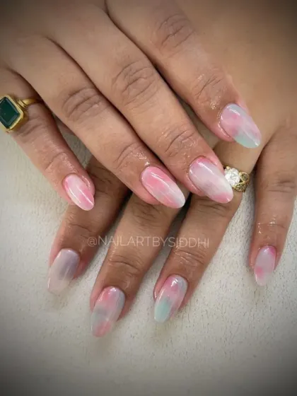 A soft, milky watercolor effect using pastel pink and blue for a dreamy, cloud-like finish.