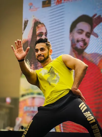 Chase your dreams with all your might. This is a shot of me in my element on stage, captured in a dynamic pose that reflects my commitment to pursuing my goals with energy and positivity.