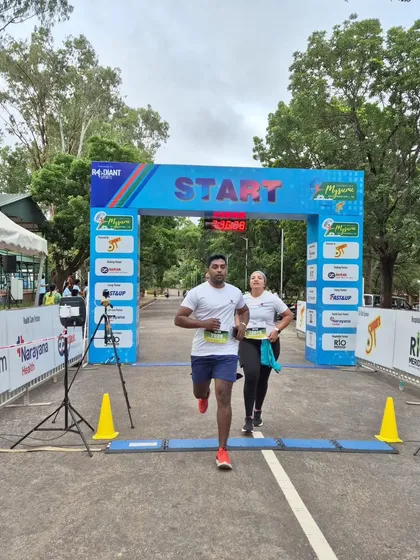 Crossing the start line at the Mysuru Run. This moment captures the beginning of the test of endurance, where mindset is everything.