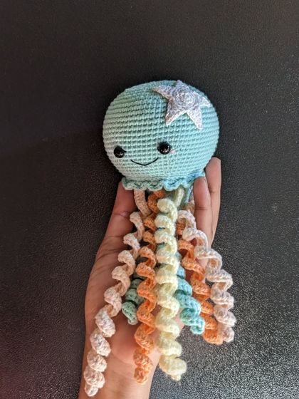 A clear shot of the jellyfish against a dark background, making its colors pop.