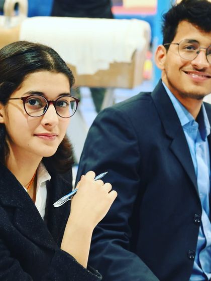 Two of our young officials, who are also senior gymnasts, learning the other side of the sport. We encourage holistic development.