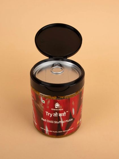 An open-lid shot of the Red Chilli Stuffed Pickle, showing the sealed packaging.