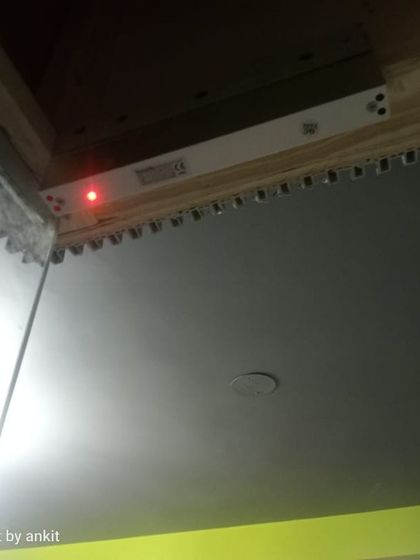 The red light on this EM lock indicates that the door is securely locked. This is a crucial component for ensuring the gym's security after hours.