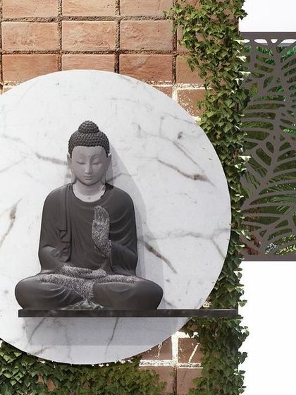 A close-up of a serene Buddha statue set against a circular marble backdrop and a vertical garden. This is a perfect feature for creating a calm entryway or courtyard.