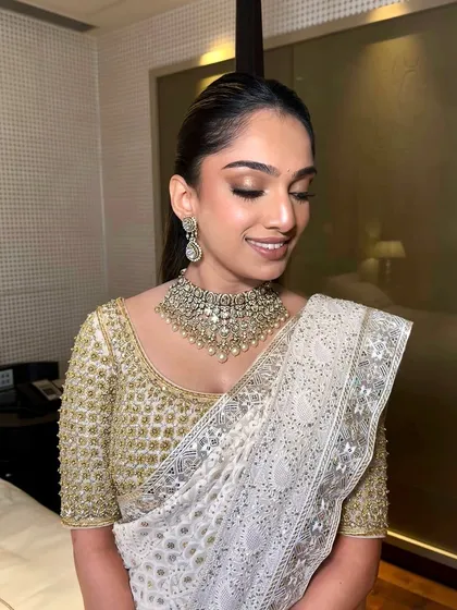 Another beautiful shot of this classic look. The makeup is designed to enhance her features and create a radiant glow that lasts all night.