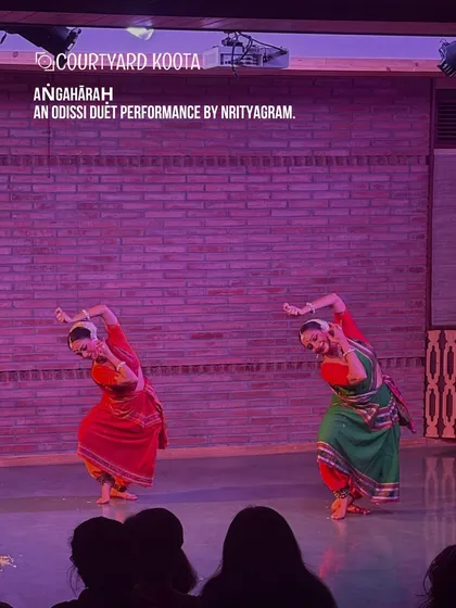 The grace of Odissi fills our stage. Here, dancers from the renowned Nrityagram perform 'Aṅgahāraḥ', a duet that showcases perfect synchronization and emotive storytelling, bringing ancient traditions to a contemporary audience in a close-up, personal setting.