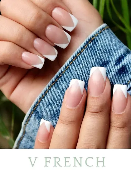 The V-French, or chevron tip, is a modern and sharp take on the classic. It elongates the nail and adds a graphic element, shown here with a crisp white tip.
