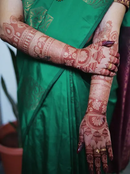 This is how a fresh henna stain looks right after the paste is removed. You can already see the beautiful orange color and the clarity of the intricate floral and geometric bands. Trust the process, as this stain will deepen into a gorgeous dark brown over the next 48 hours.