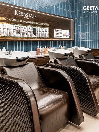 The hair spa at our Shilp Shivalik salon, featuring beautiful blue tiling and luxurious chairs for a transformative experience.