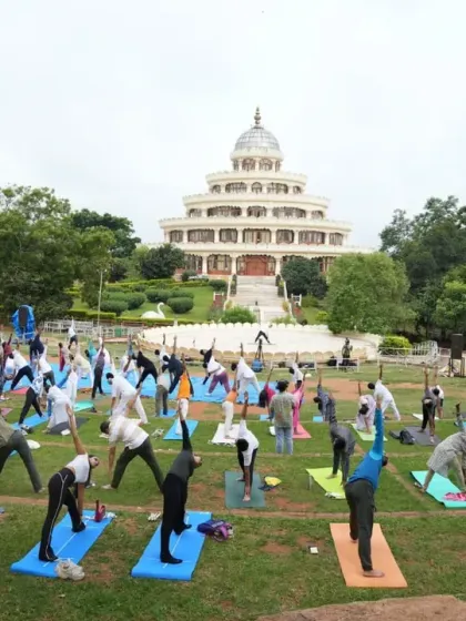 We celebrate the spirit of yoga with thousands of enthusiasts at the Art of Living International Center. This was taken during the International Day of Yoga, where people of all ages and backgrounds join together for a massive outdoor yoga session.
