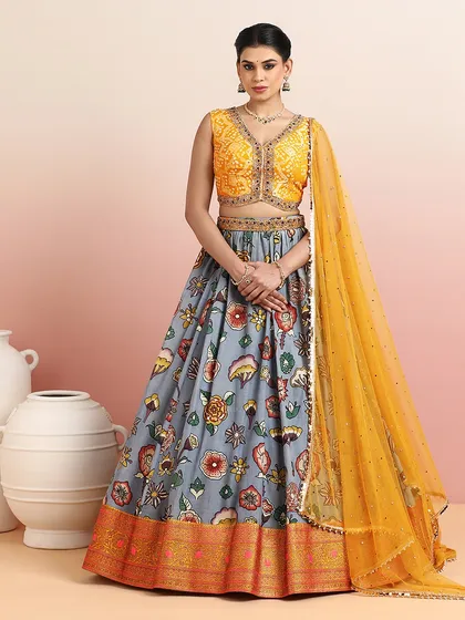 The grey floral lehenga complete with its matching yellow dupatta, creating a cohesive and elegant look.