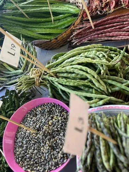 A variety of fresh beans and seeds at a local market, showing the agricultural diversity of the region.