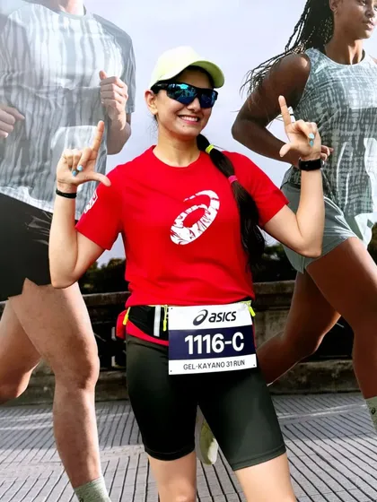 A creative shot of a runner from our club, celebrating her personal best at the 10k launch run.