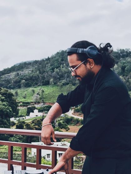 Finding my focus and rhythm while DJing outdoors. The natural backdrop adds a different kind of inspiration to the music.