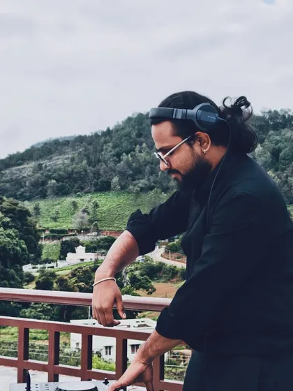 Finding my focus and rhythm while DJing outdoors. The natural backdrop adds a different kind of inspiration to the music.