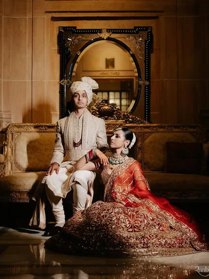 A classic, regal portrait of the couple, embodying the luxury and elegance of the event.