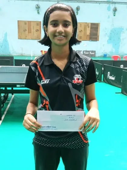 Anvi Thorat holds her prize after clinching a bronze medal in the U-15 girls' category at the 1st Maharashtra State Ranking tournament.