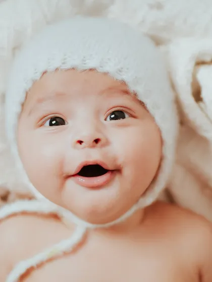 A bright-eyed and happy baby. His personality is already shining through at just a few months old.