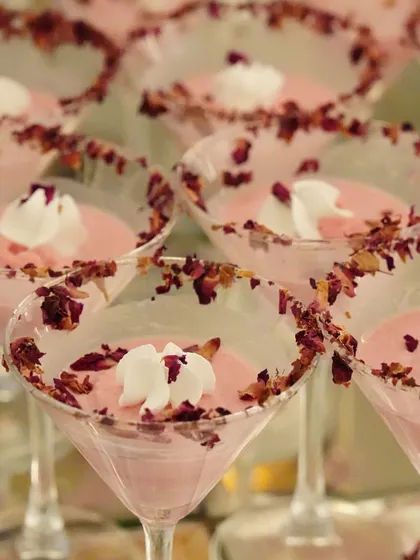 Rose-flavoured panna cotta served in martini glasses, with the rims garnished with dried rose petals. A truly elegant and romantic dessert.