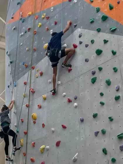 Climbing side-by-side with a friend is a great way to stay motivated and share the experience.