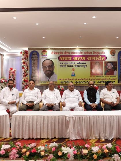 The main dais at the oath-taking ceremony. I have extensive experience hosting events with formal stage setups and multiple dignitaries.
