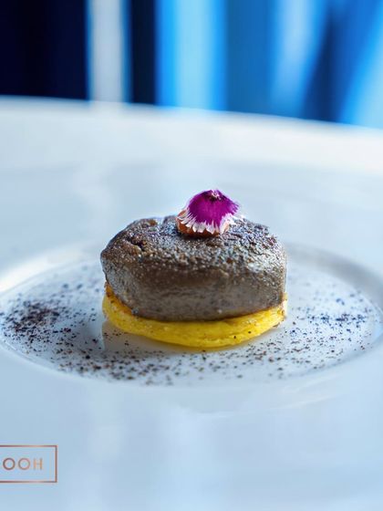 The Beetroot Murabba Kebab, served on a saffron-infused base and sprinkled with a savory powder. The combination of sweet and savory is truly unexpected.