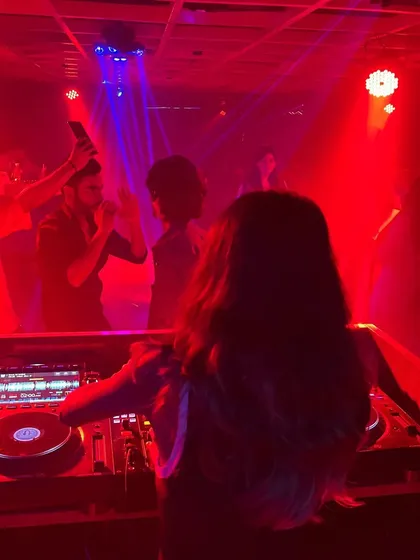 Capturing the energy of the crowd as they react to a beat drop during my set.
