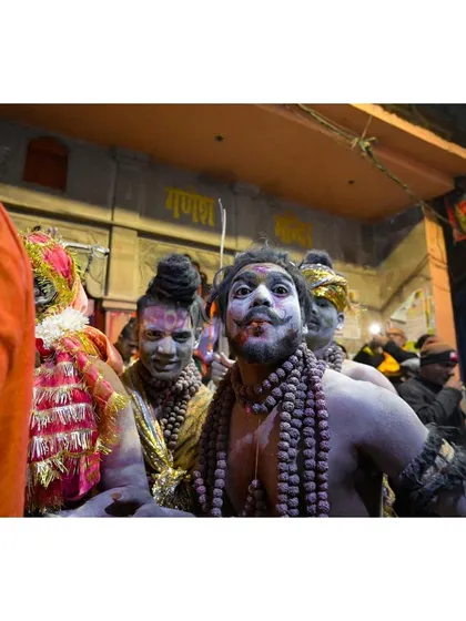 A candid portrait of a participant during a festival procession in the streets of Kashi. My goal is to get close and capture the raw emotion and character in people's faces, showing their faith without filters or posing.