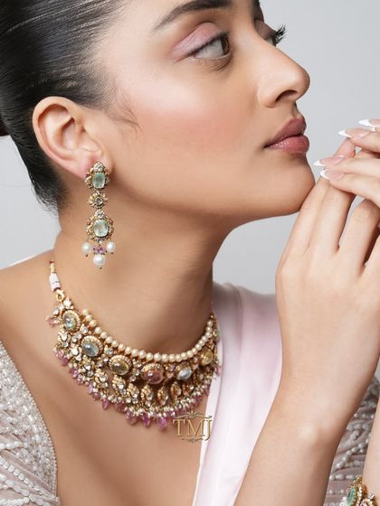 A detailed look at our pastel Navratan set, including the choker and matching sage green earrings with pearl drops.