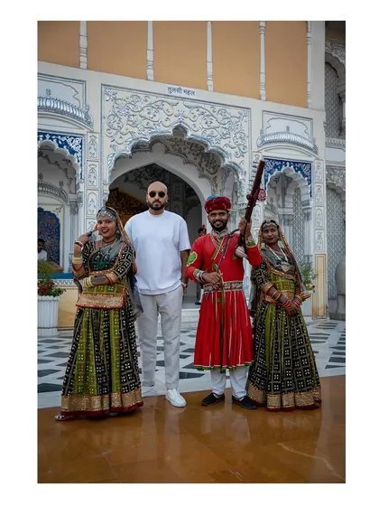 Posing with traditional performers in Jaipur. It's all about embracing the local culture and creating an authentic experience.