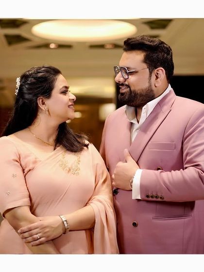 An indoor shot of the same couple, showcasing our ability to capture great photos in different lighting conditions, both outdoors and indoors.