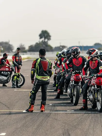Riders lined up on the grid during a training day. This image captures the anticipation and focus before a session begins.