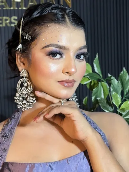 A final portrait of the purple glam look, perfect for a sangeet or reception.