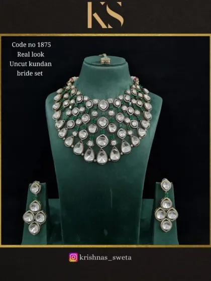 This version of the real-look uncut Kundan set features a classic emerald green color scheme, perfect for a traditional yet elegant look.