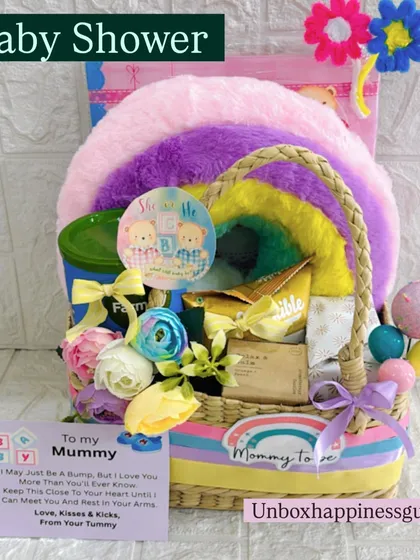 This image highlights the "Baby Shower" tag on the rainbow hamper, making it clear this is a perfect gift for the occasion.
