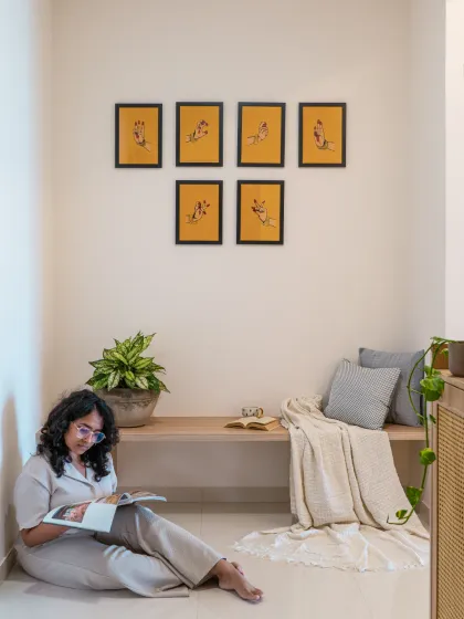 How do you design an entryway without cluttering it? For this foyer, we kept it simple. A low bench provides a cozy nook for reading or putting on shoes, complemented by a rattan shoe rack that adds texture. The space feels complete and functional without taking attention away from the rest of the home.