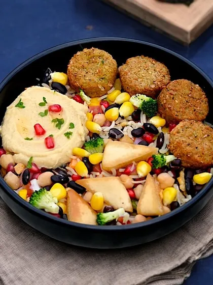 Our Falafel Hummus Power Bowl is packed with crispy falafel, creamy hummus, and a rainbow of fresh toppings. It's a flavorful and nutritious option that's perfect for a satisfying lunch or dinner.