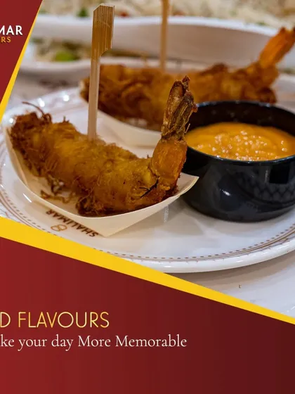 We use bold flavors to make your day more memorable. These crispy fried prawns are served with a tangy dipping sauce, offering a delightful crunch and taste.