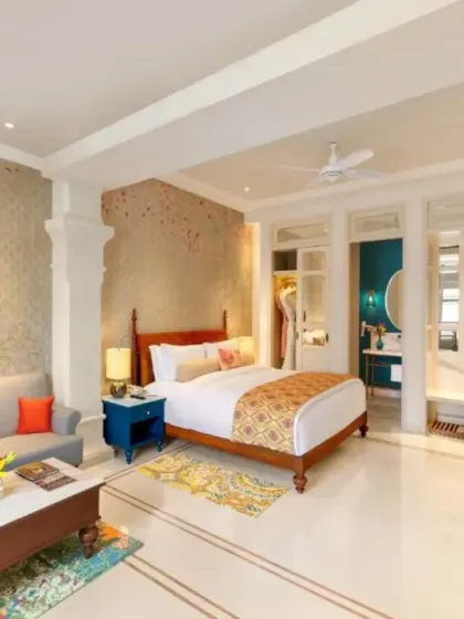 A suite I designed for IHCL Pilibhit House in Haridwar, where tradition meets opulence. The room features custom wallpaper with subtle patterns, classic wooden furniture, and a thoughtfully arranged layout to create a sense of grandeur and comfort.